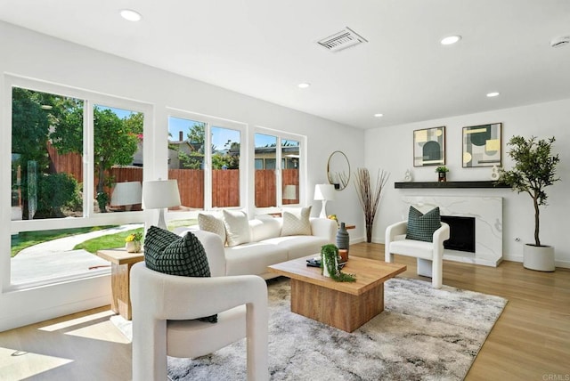 305 Spruce St, Chula Vista, CA 91911 - living area featuring recessed lighting, a premium fireplace, and wood finished floors