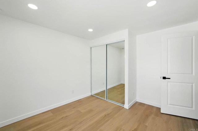 305 Spruce St, Chula Vista, CA 91911 - unfurnished bedroom with light wood finished floors, a closet, and recessed lighting