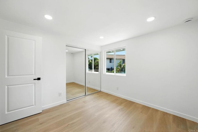 305 Spruce St, Chula Vista, CA 91911 - unfurnished bedroom featuring light wood-style flooring, a closet, and recessed lighting