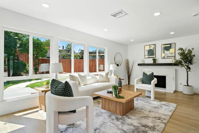 305 Spruce St, Chula Vista, CA 91911 - living area featuring recessed lighting, a premium fireplace, and wood finished floors