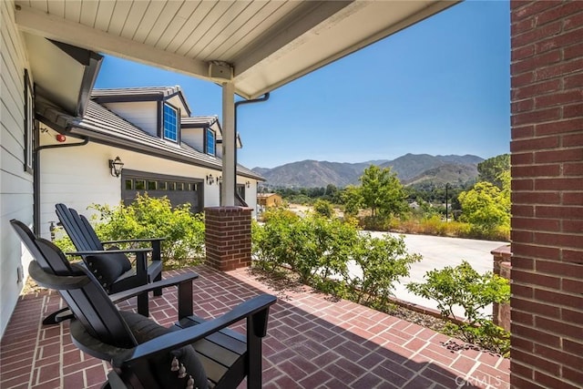 16261 Pineview Rd, Canyon Country, CA 91387 - view of patio featuring a mountain view and an attached garage