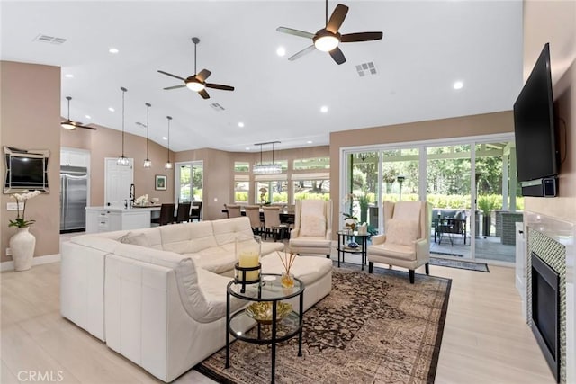 16261 Pineview Rd, Canyon Country, CA 91387 - living area featuring ceiling fan, a tile fireplace, high vaulted ceiling, and recessed lighting