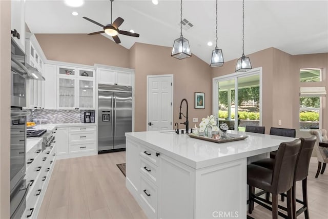 16261 Pineview Rd, Canyon Country, CA 91387 - kitchen featuring built in fridge, a ceiling fan, light countertops, vaulted ceiling, and recessed lighting