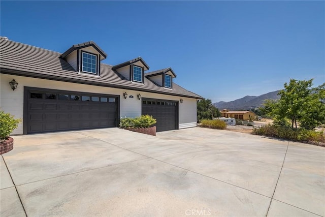 16261 Pineview Rd, Canyon Country, CA 91387 - view of front facade with driveway, a mountain view, a tile roof, and a garage