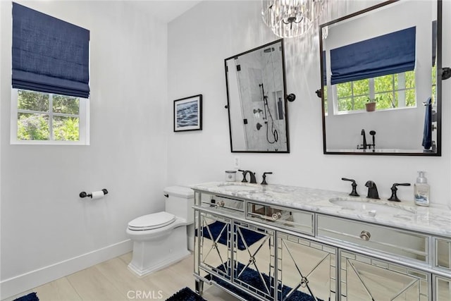16261 Pineview Rd, Canyon Country, CA 91387 - bathroom featuring double vanity, a shower, a chandelier, and wood finished floors