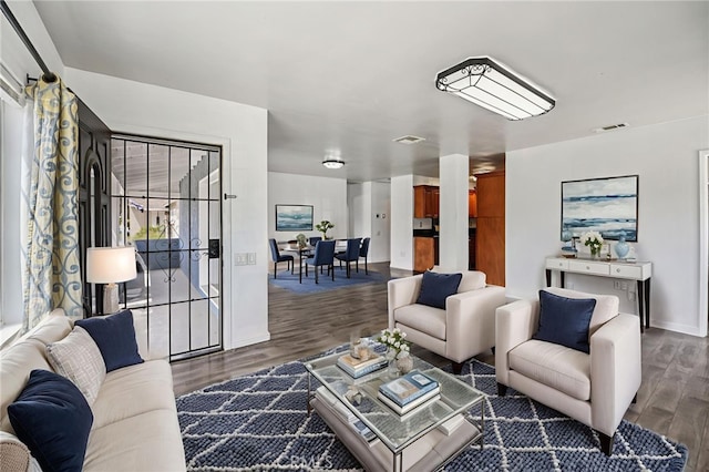 7803 Clive Ave, Whittier, CA 90606 - living room with dark wood-style flooring and baseboards