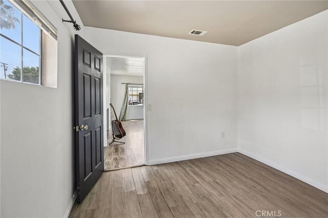 7803 Clive Ave, Whittier, CA 90606 - unfurnished room with wood finished floors and baseboards