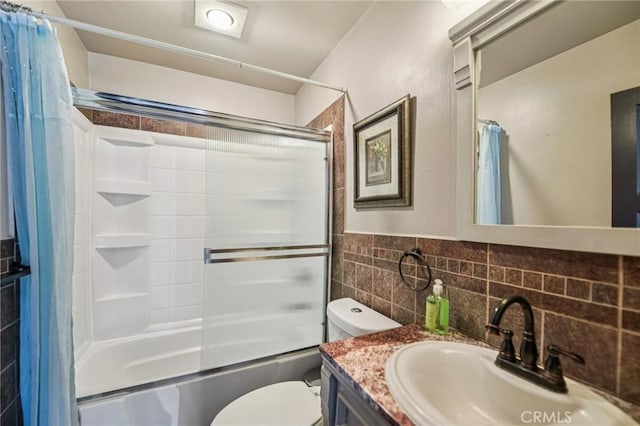 7803 Clive Ave, Whittier, CA 90606 - bathroom featuring tile walls, vanity, and shower / bath combo with shower curtain