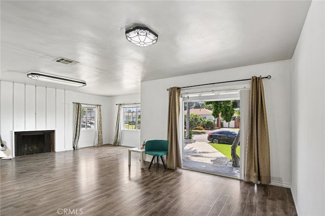 7803 Clive Ave, Whittier, CA 90606 - sitting room featuring wood finished floors and a fireplace