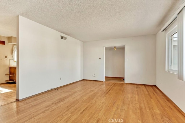 4760 73rd St, La Mesa, CA 91942 - unfurnished room featuring a textured ceiling and light wood-style floors