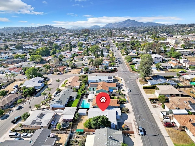 4760 73rd St, La Mesa, CA 91942 - aerial overview of property's location with a mountain backdrop and nearby suburban area