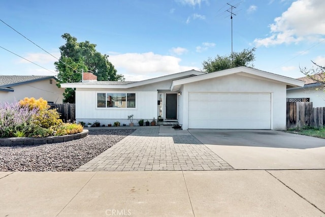 4760 73rd St, La Mesa, CA 91942 - ranch-style home with concrete driveway, a garage, and a chimney