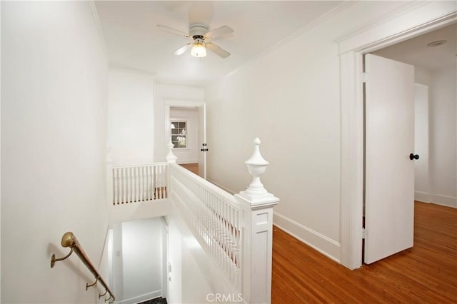 738 S Norton Ave, Los Angeles, CA 90005 - hallway featuring an upstairs landing, wood finished floors, and crown molding