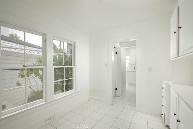738 S Norton Ave, Los Angeles, CA 90005 - corridor with healthy amount of natural light and light tile patterned floors