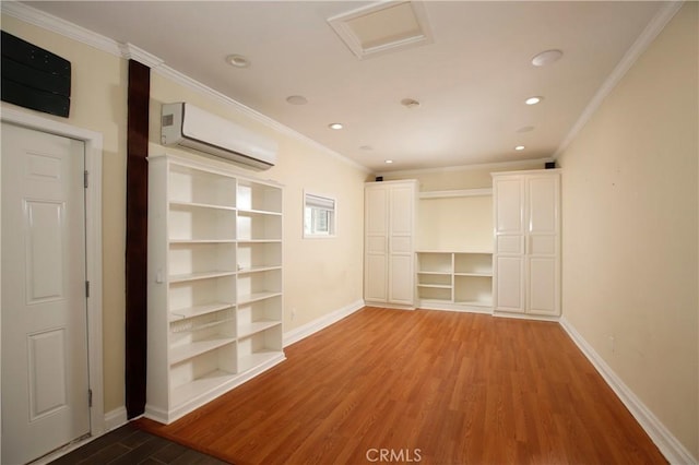 738 S Norton Ave, Los Angeles, CA 90005 - unfurnished room featuring a wall unit AC, wood finished floors, recessed lighting, crown molding, and attic access