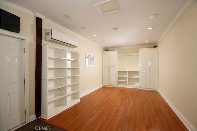 738 S Norton Ave, Los Angeles, CA 90005 - spare room with an AC wall unit, wood finished floors, recessed lighting, crown molding, and attic access
