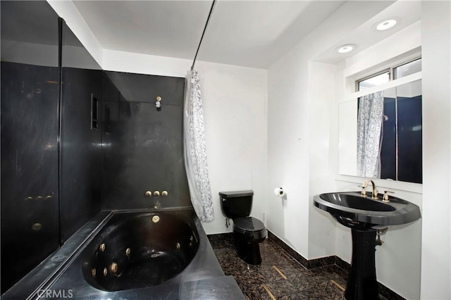 738 S Norton Ave, Los Angeles, CA 90005 - bathroom with a whirlpool tub and marble finish flooring