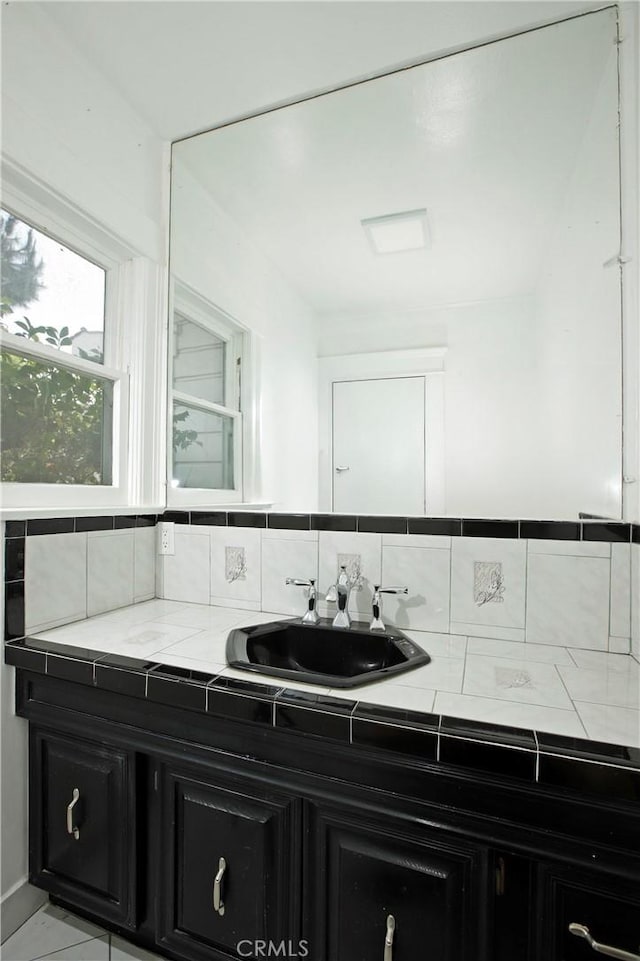 738 S Norton Ave, Los Angeles, CA 90005 - bathroom featuring vanity and tasteful backsplash