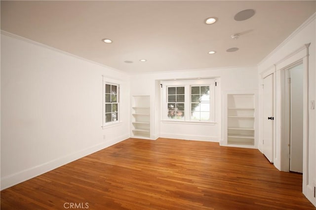 738 S Norton Ave, Los Angeles, CA 90005 - unfurnished room with crown molding, built in shelves, recessed lighting, wood finished floors, and a smoke detector