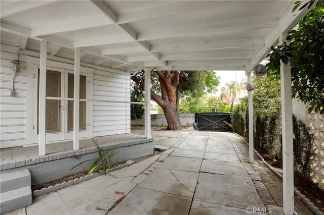 738 S Norton Ave, Los Angeles, CA 90005 - view of patio with french doors and a gate