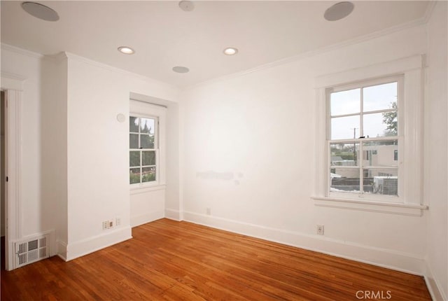 738 S Norton Ave, Los Angeles, CA 90005 - spare room featuring ornamental molding, wood finished floors, plenty of natural light, and recessed lighting