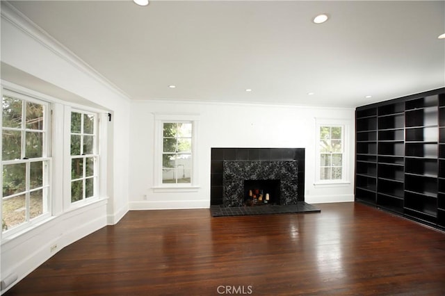 738 S Norton Ave, Los Angeles, CA 90005 - unfurnished living room with ornamental molding, wood finished floors, a fireplace, and recessed lighting