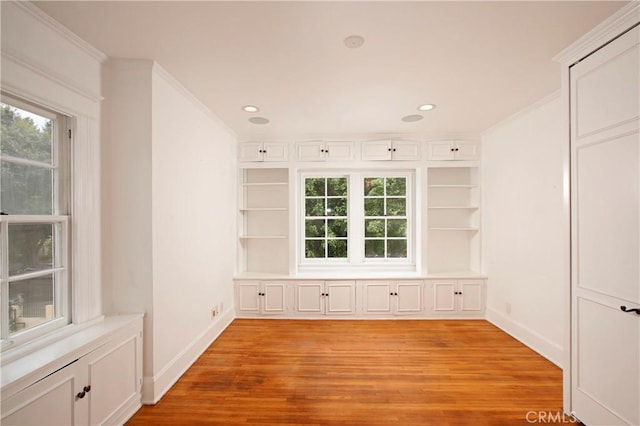 738 S Norton Ave, Los Angeles, CA 90005 - empty room with light wood-style flooring, crown molding, and recessed lighting