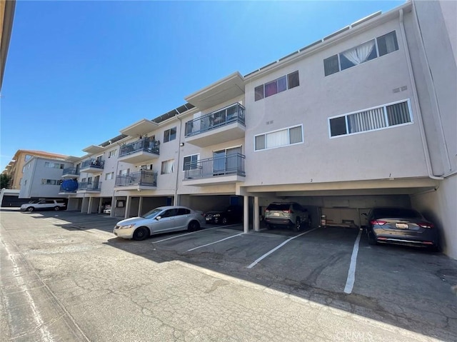 8070 Langdon Ave, Van Nuys, CA 91406 - view of apartment building / complex featuring covered parking