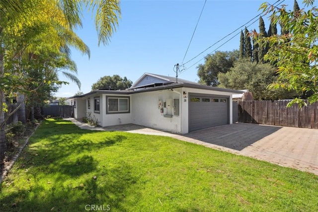311 Prospect St, Oak View, CA 93022 - view of front facade with a garage, stucco siding, and driveway