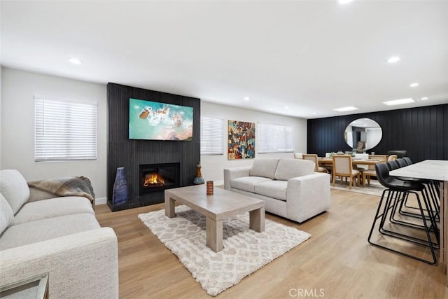 311 Prospect St, Oak View, CA 93022 - living room with a fireplace, recessed lighting, light wood-style flooring, and an accent wall