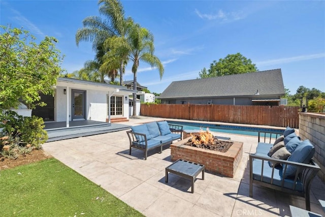 311 Prospect St, Oak View, CA 93022 - fenced backyard featuring a patio area, an outdoor living space with a fire pit, an outbuilding, and an exterior structure