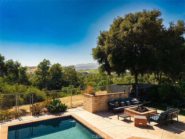 311 Prospect St, Oak View, CA 93022 - view of swimming pool featuring a patio area, a mountain view, and an outdoor living space with a fire pit