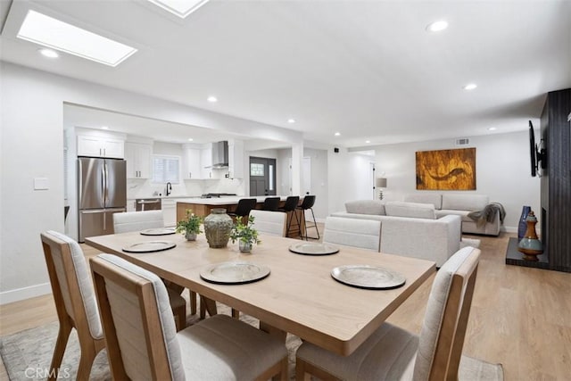 311 Prospect St, Oak View, CA 93022 - dining area with light wood-style flooring and recessed lighting