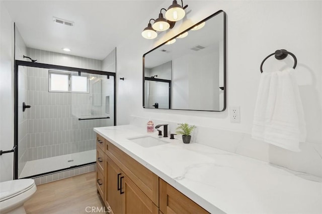 311 Prospect St, Oak View, CA 93022 - full bathroom with vanity, a stall shower, and wood finished floors