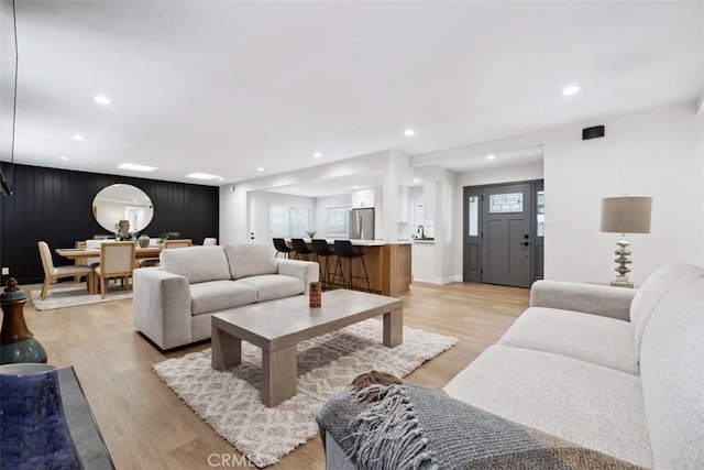 311 Prospect St, Oak View, CA 93022 - living room featuring light wood-type flooring, recessed lighting, and an accent wall
