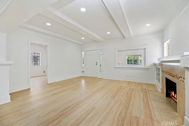 2018 W Martin Luther King Jr Blvd, Los Angeles, CA 90062 - unfurnished living room with a tile fireplace, light wood-style flooring, beam ceiling, ornamental molding, and recessed lighting