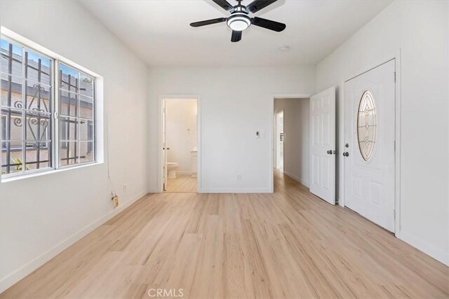 2018 W Martin Luther King Jr Blvd, Los Angeles, CA 90062 - foyer with light wood-style floors and ceiling fan