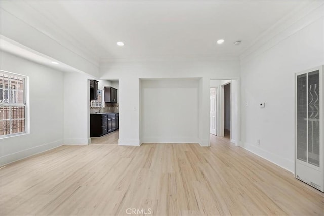 2018 W Martin Luther King Jr Blvd, Los Angeles, CA 90062 - unfurnished living room featuring a heating unit, light wood finished floors, ornamental molding, and recessed lighting