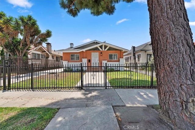 2018 W Martin Luther King Jr Blvd, Los Angeles, CA 90062 - bungalow-style house with stucco siding and a fenced front yard