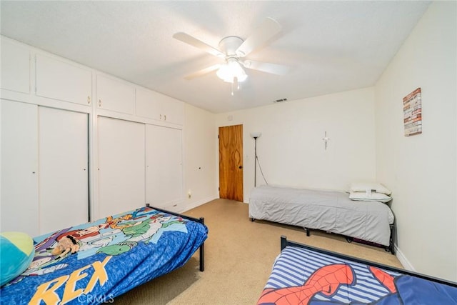 12995 Leith Way, Yucaipa, CA 92399 - bedroom with light colored carpet, a closet, and ceiling fan