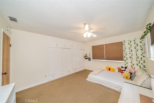 12995 Leith Way, Yucaipa, CA 92399 - bedroom with light carpet, a ceiling fan, a closet, and a textured ceiling