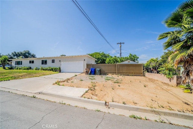 12995 Leith Way, Yucaipa, CA 92399 - view of yard featuring an attached garage and driveway
