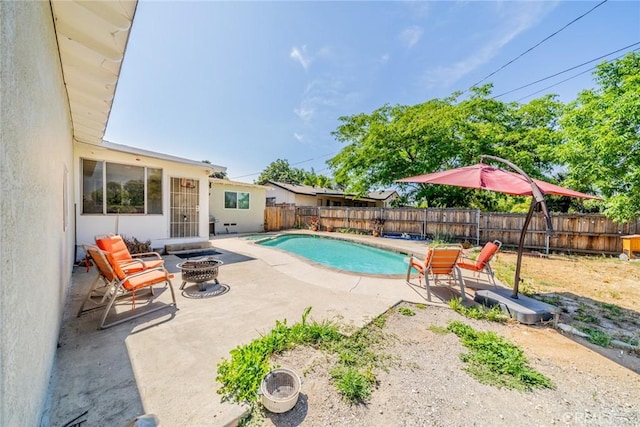 12995 Leith Way, Yucaipa, CA 92399 - view of pool with an outdoor fire pit, a patio, and a fenced backyard
