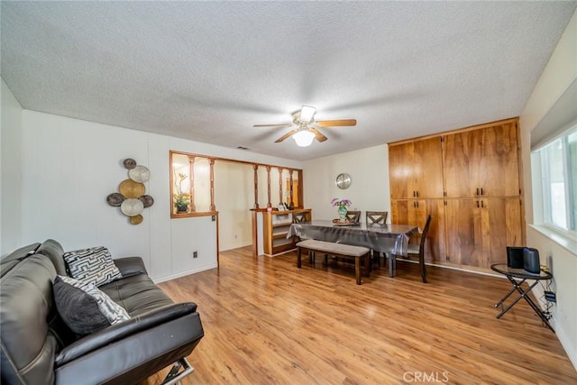 12995 Leith Way, Yucaipa, CA 92399 - living area featuring ceiling fan, light wood-type flooring, and a textured ceiling
