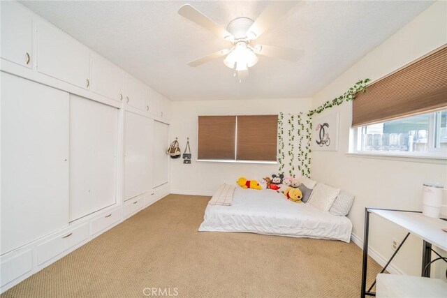 12995 Leith Way, Yucaipa, CA 92399 - bedroom featuring light carpet and a ceiling fan