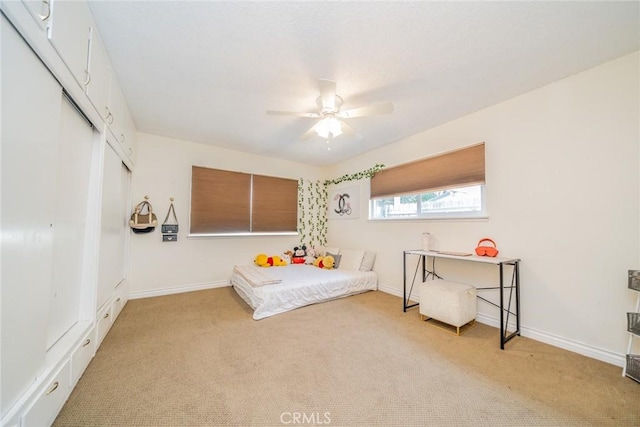 12995 Leith Way, Yucaipa, CA 92399 - bedroom with light colored carpet, a closet, and a ceiling fan