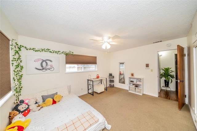 12995 Leith Way, Yucaipa, CA 92399 - bedroom featuring light carpet, a textured ceiling, and ceiling fan
