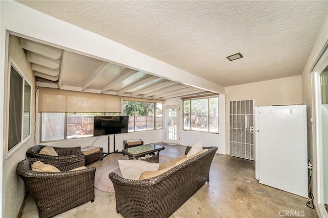 12995 Leith Way, Yucaipa, CA 92399 - living room with concrete floors and a textured ceiling