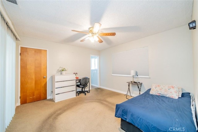 12995 Leith Way, Yucaipa, CA 92399 - carpeted bedroom with a desk, a textured ceiling, and a ceiling fan
