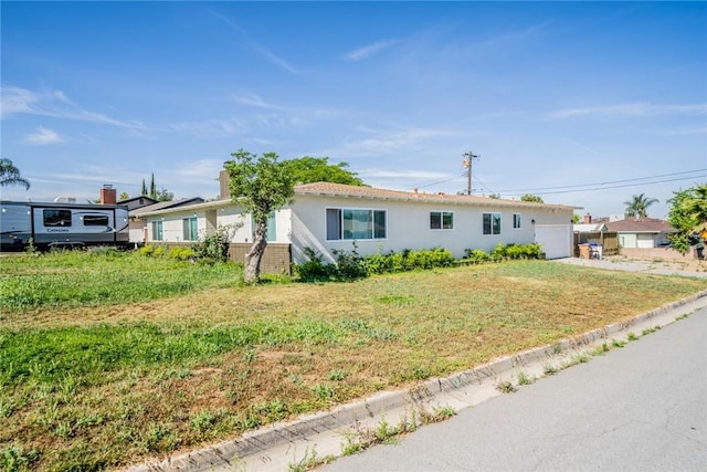 12995 Leith Way, Yucaipa, CA 92399 - ranch-style house featuring stucco siding, an attached garage, and a front lawn